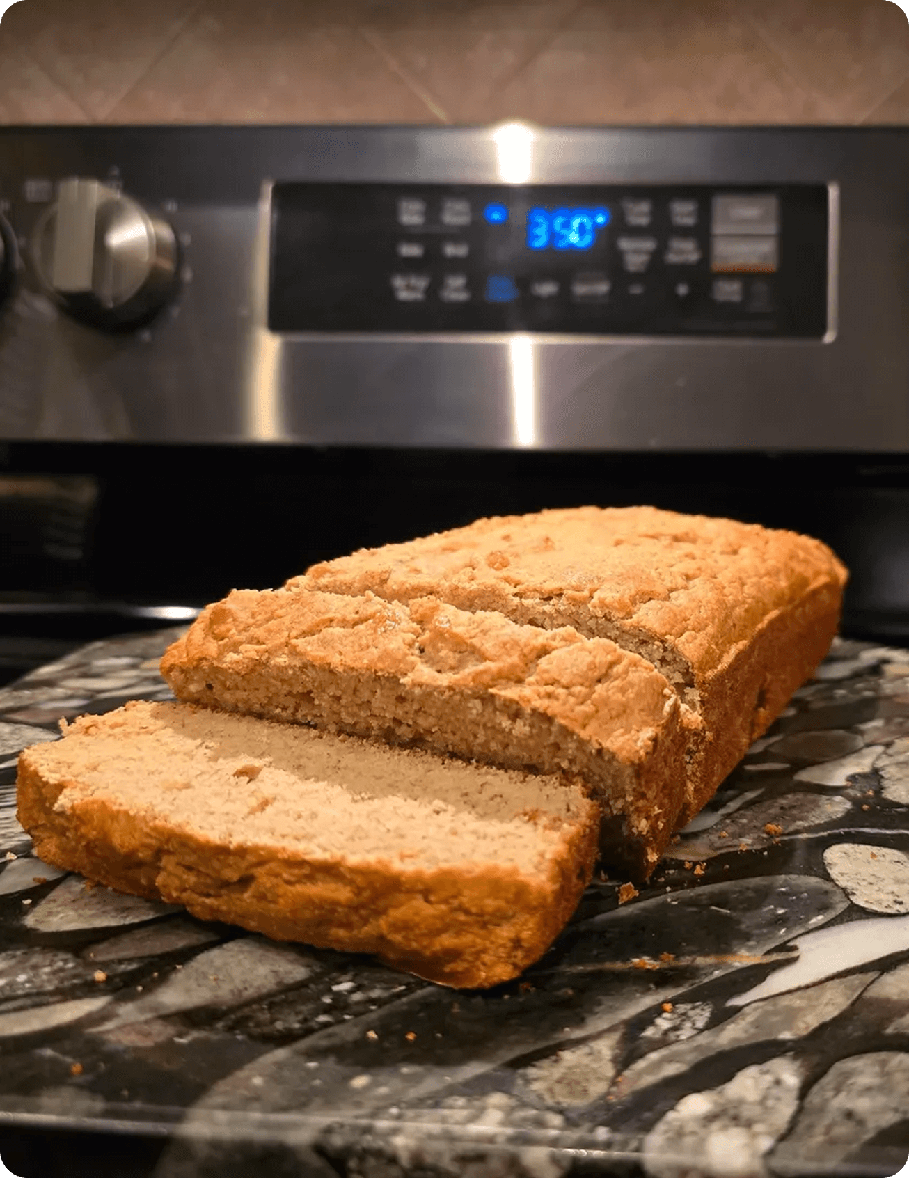 Sliced homemade bread on a kitchen counter.