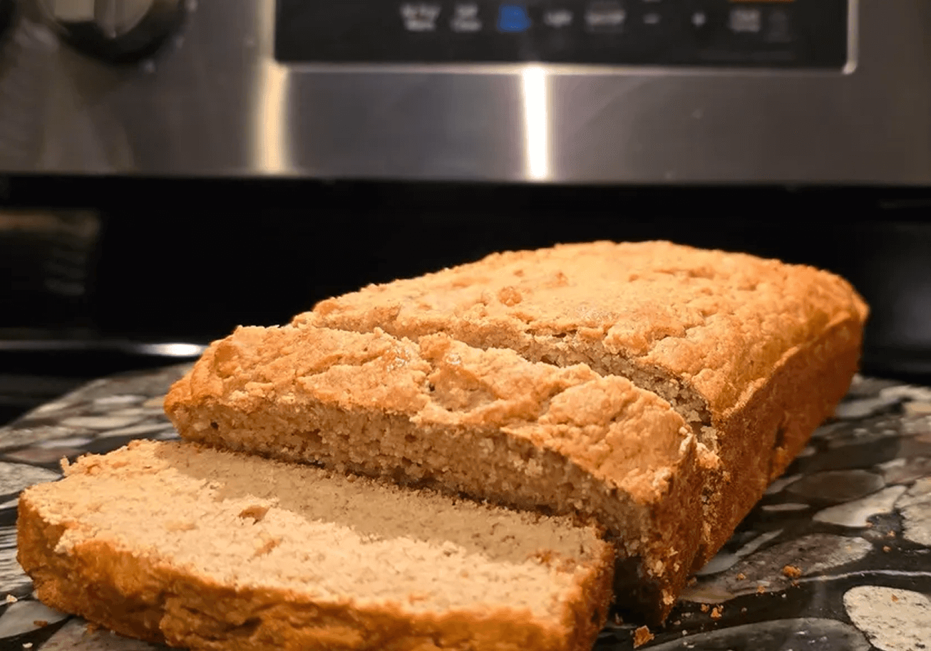 Sliced homemade bread on a kitchen counter.